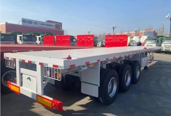 Q345b Κύρια δέσμη 3 άξονες 20ft 40ft Συσκευαστήρα Μεταφορά 60-100Tons επίπεδα κρεβάτια επίπεδα φορτηγά φορτηγά ημιπροκατασκευή